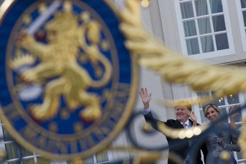 Dutch King Willem-Alexander and Queen Maxima wave to well-wishers from the balcony of royal palace Noordeinde in The Hague, Netherlands.