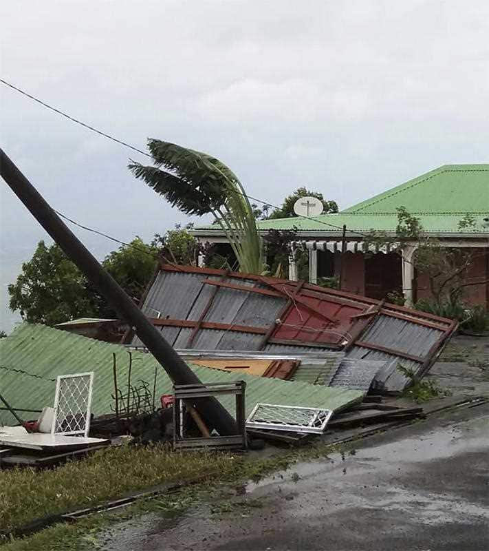 This photo provided by Jenny Promeneur shows storm damage to her grandmother's tool shed/dog house, caused by Hurricane Maria in Bouillante, Guadeloupe, Tuesday, Sept. 19, 2017.
