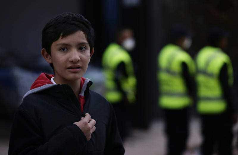 Rodrigo Arelia, a student who escaped from the rubble of his Enrique Rebsamen school, stands outside the building that collapsed during an earthquake in Mexico 