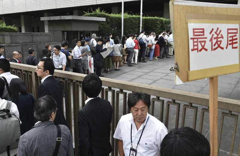People line to hear Dentsu's first trial at Tokyo District Court. Matsuri Takahashi, the female employee, who was 24, killed herself in December 2015 due to overwork.