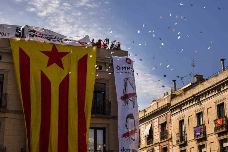 Catalan independence demonstrators ballot papers Sant Jaume square Barcelona, Spain