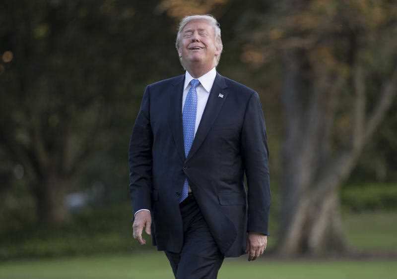 President Donald Trump reacts as he walks from Marine One across the South Lawn of the White House in Washington, Wednesday, Sept. 27, 2017.