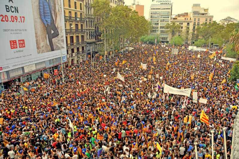 University students hold Catalan pro-independence 'Estelada' flag during a demonstration against the position of the Spanish government on the referendum on self-determination in Catalonia during a university students strike on September 28, 2017.