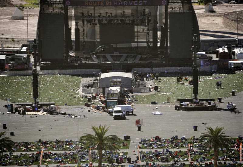 Debris is strewn through the scene of a mass shooting at a music festival near the Mandalay Bay resort and casino on the Las Vegas Strip, Monday, Oct. 2, 2017, in Las Vegas.