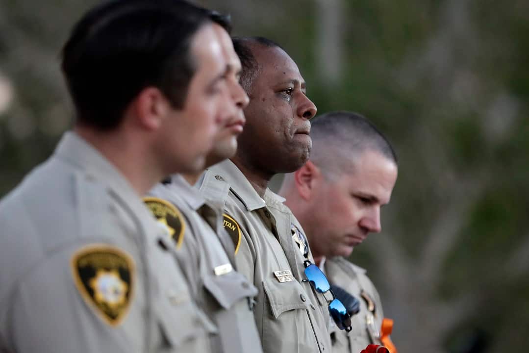 Jonathon Ghebrecristos cries during a candlelight vigil for Charleston Hartfield
