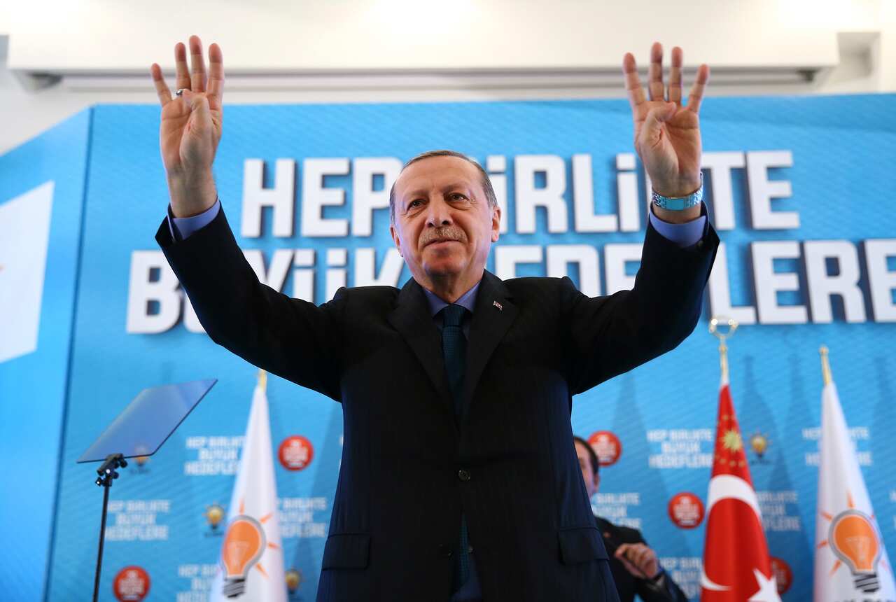 Turkey's President Recep Tayyip Erdogan, waves to supporters after he delivered a speech at his ruling political party's conference in Afyonkarahisar province in western Turkey, Sunday, Oct. 8, 2017. (Pool Photo via AP)