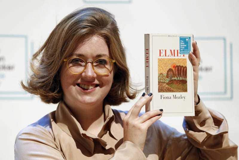 Author Fiona Mozley of Britain with her book 'Elmet' during a photocall with all six shortlisted authors of the 2017 Man Booker Prize for Fiction, in London, Monday, Oct. 16, 2017.