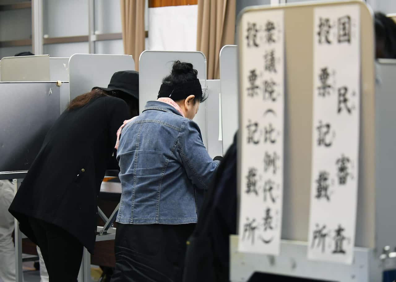 Voters cast their ballots in the election in Nagoya, central Japan.