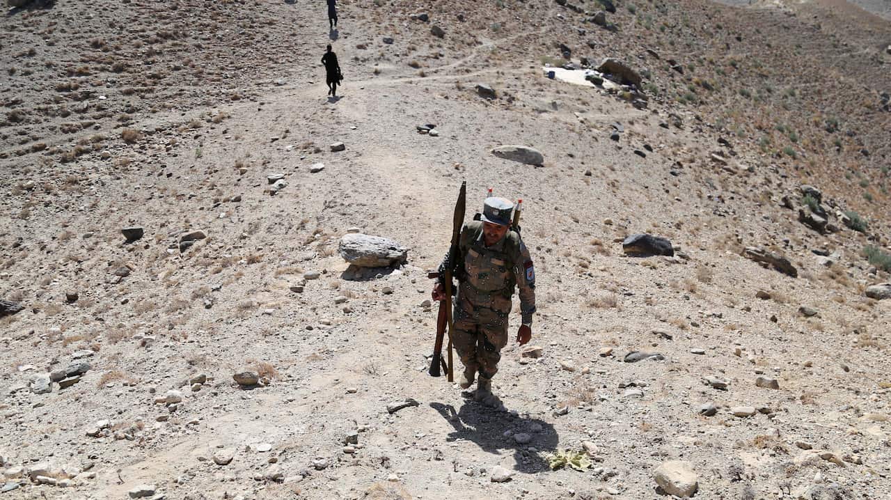 Afghan soldiers partol during an operation against militants, including Islamic State, in Khogiyani.