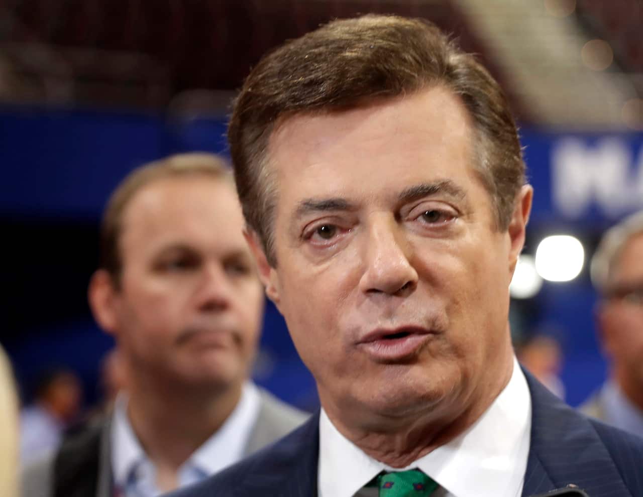 In this July 17, 2016 file photo, Trump campaign chairman Paul Manafort talks to reporters on the floor of the Republican National Convention at Quicken Loans Arena in Cleveland.