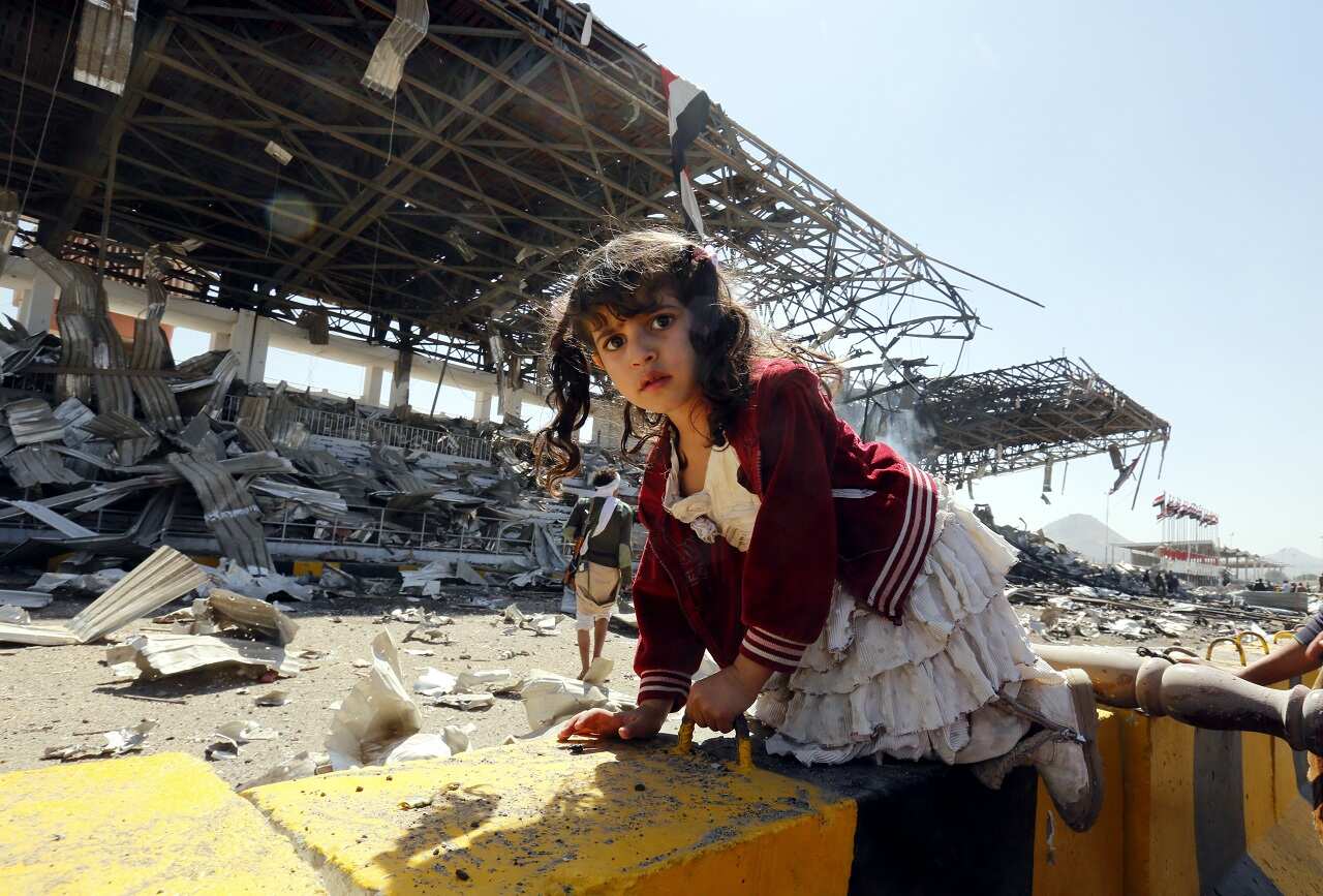 A Yemeni child in front of an alleged Saudi-led airstrike site in Sana'a, a day after Houthi rebels fired a ballistic missile at the Saudi capital Riyadh