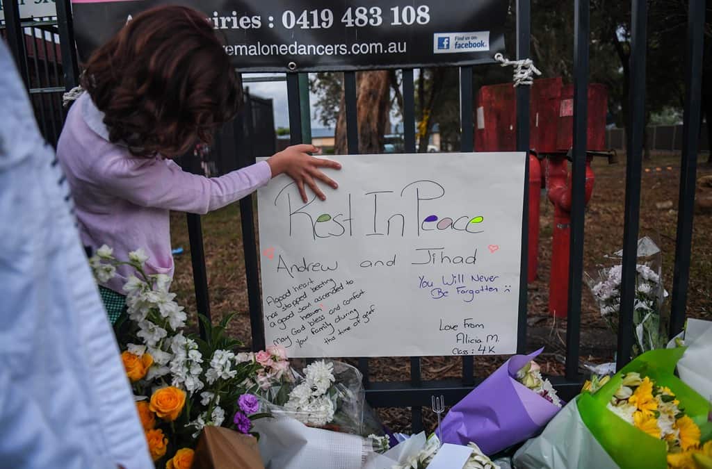 Members of the community attend a vigil outside Banksia Road Public School, Greenacre, Sydney