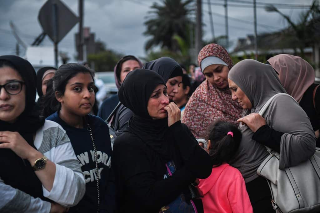 Members of the community attend a vigil outside Banksia Road Public School, Greenacre