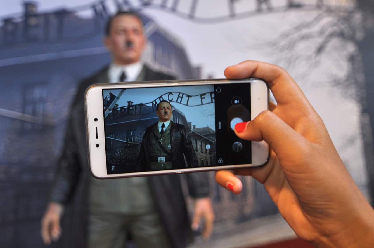 (File Image) A visitor uses a mobile phone to take a photo of the waxwork.