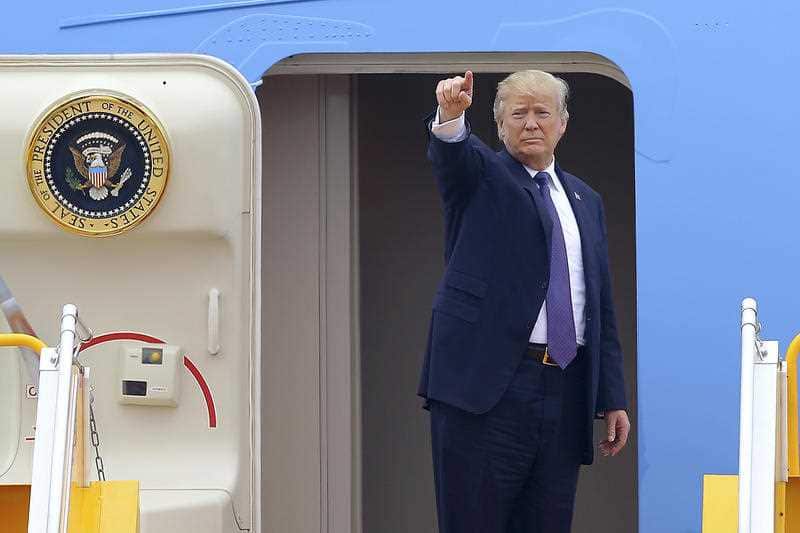 U.S. President Donald Trump boards Air Force One before departing from Noi Bai international airport, in Hanoi, Vietnam Sunday, Nov. 12, 2017.