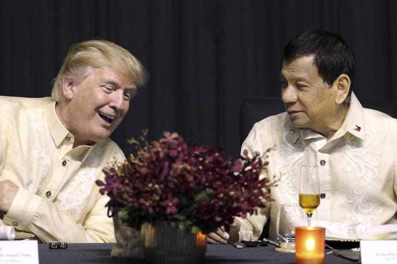 U.S. President Donald Trump, left, talks with Philippine President Rodrigo Duterte during the gala dinner marking ASEAN's 50th anniversary in Manila, Philippines.