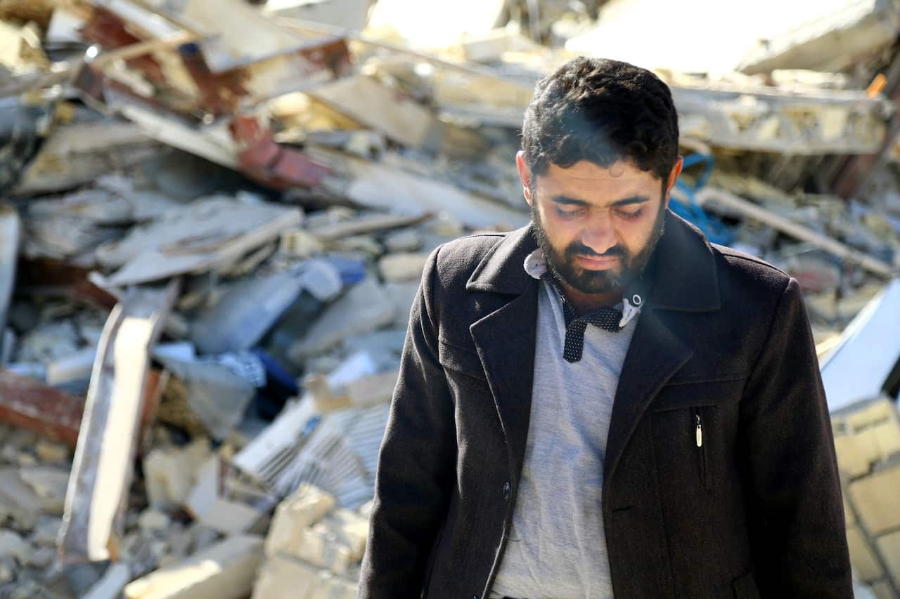 A man in Sarpol-e Zahab, western Iran, is devastated Nov. 13, 2017, after losing his entire family to a magnitude-7.3 earthquake