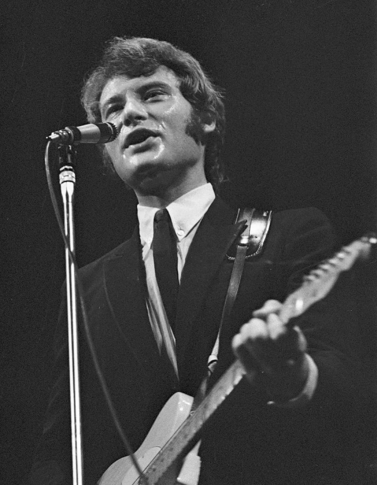 French singer Johnny Hallyday performs during the concert in Prague, Czechoslovakia, July 1, 1966. Photo/Jiri Krulis (CTK via AP Images)