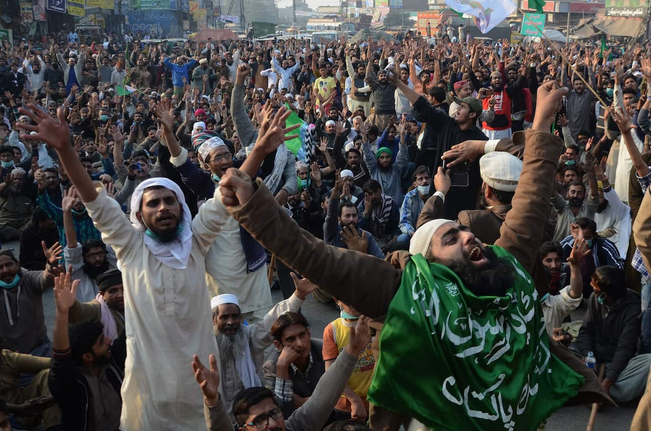 Members of the Tehreek-i-Labaik Yah Rasool Allah Pakistan religious group chant slogans against the government during a protest in Lahore.
