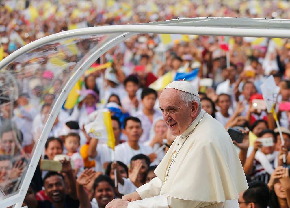 Pope Francis stands on the Popemobile as he arrives to lead a mass at Kyaikkasan grounds in Yangon, Myanmar, 29 November 2017. Pope Francis' visit in Myanmar and Bangladesh runs from 27 November to 02 December 2017.  EPA/LYNN BO BO