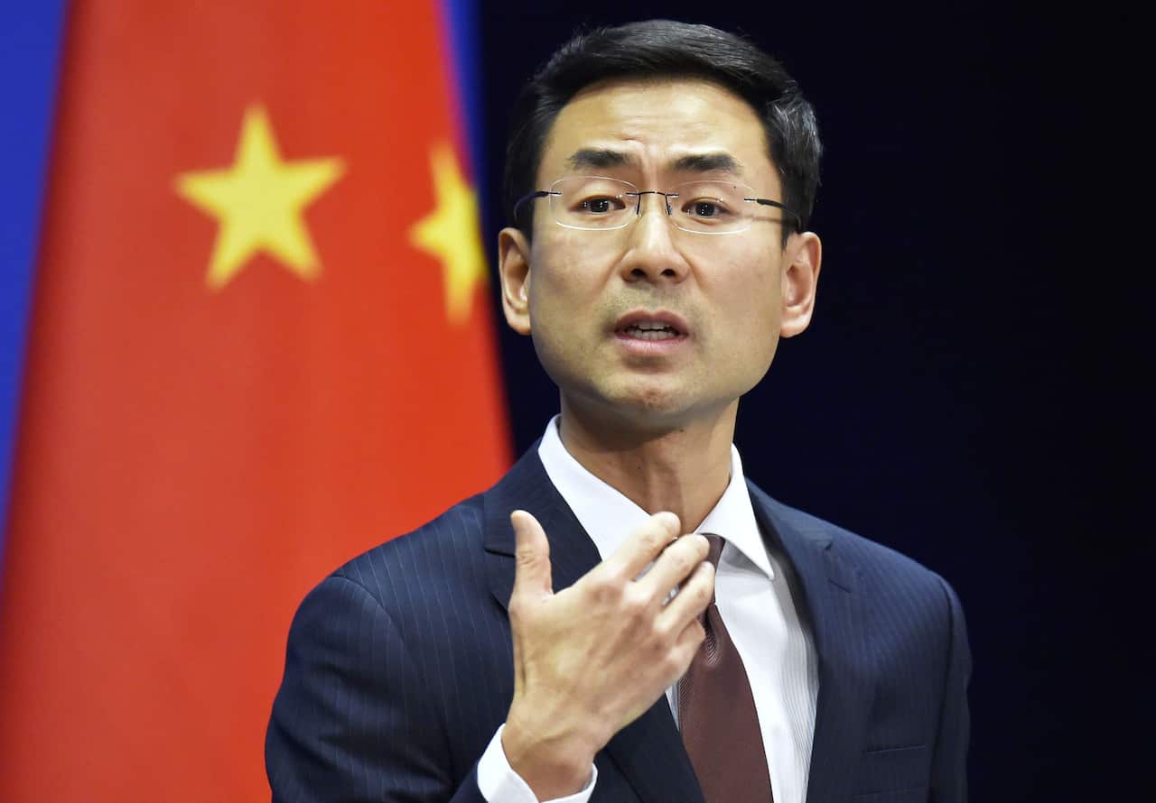 Chinese Foreign Ministry spokesman Geng Shuang speaks at a press briefing.