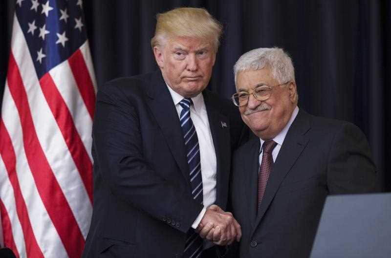 US President Donald J. Trump (L) shakes hands with Palestinian President Mahmoud Abbas (R) after they held a joint press conference at Abbas' residence in Bethlehem, the West Bank, 23 May 2017,