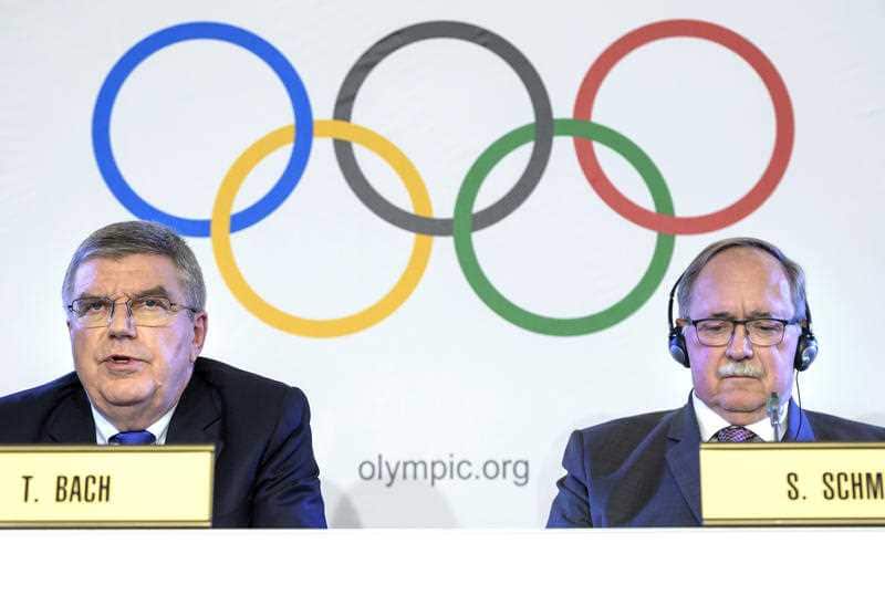 International Olympic Committee, IOC, President Thomas Bach from Germany, left, and Samuel Schmid, President of the IOC Inquiry Commission and former President of Switzerland, right, comment during a press conference after an Executive Board meeting.