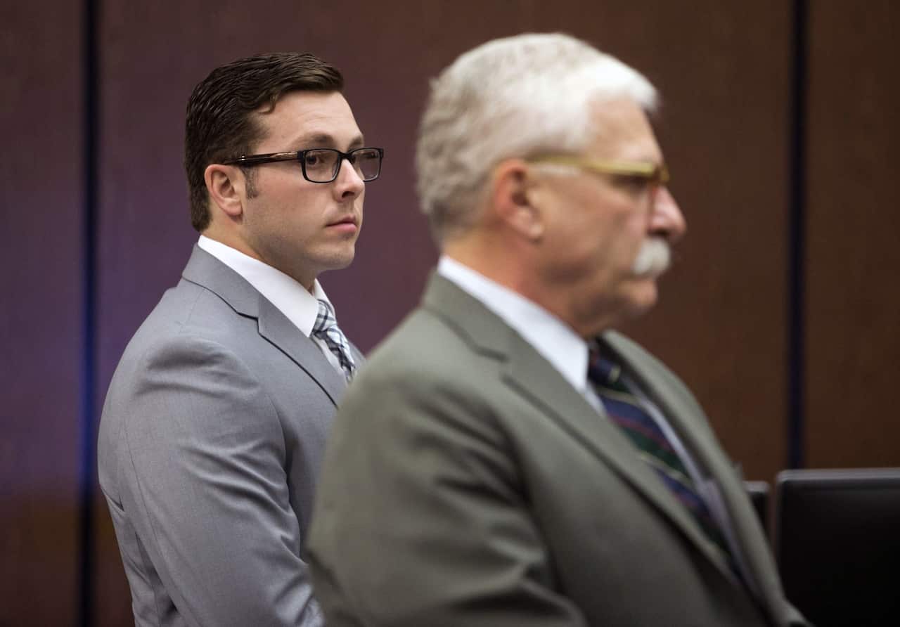 Former Mesa police officer Philip Brailsford (L) and his attorney at the start of Brailsford's murder trial in Phoenix.