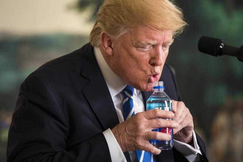 US President Donald J. Trump pauses to drink water while touting his foreign policy accomplishments during his trip to Asia in a speech in the Diplomatic Room at the White House in Washington, DC, 15 November 2017.