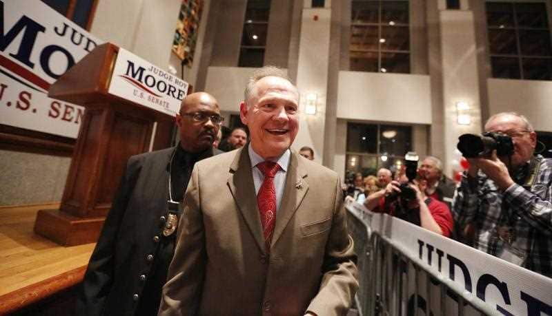 U.S. Senate candidate Roy Moore greets supporters during an election-night watch party at the RSA activity center, Tuesday, Dec. 12, 2017, in Montgomery, Alabama.