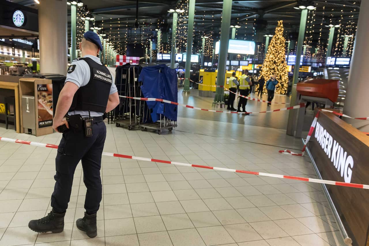 The knife-wielding man was shot by military police at Schipol Airport in Amsterdam.