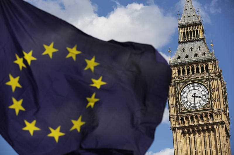 File photo of a European Union flag in front of the Elizabeth Tower. The Government is facing new calls to release confidential studies drawn up by officials looking at the potential impact of Brexit on the economy.