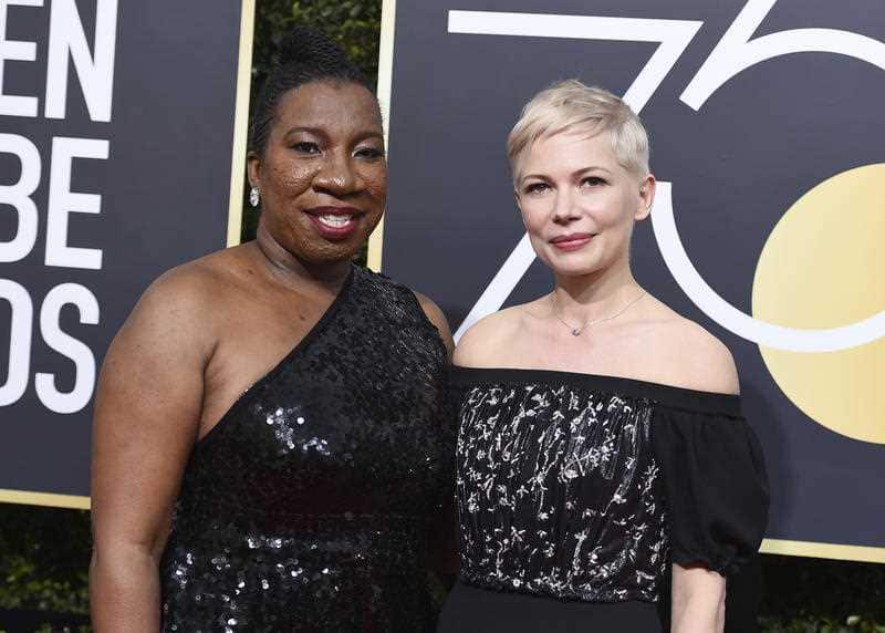 Tarana Burke, left, and Michelle Williams arrive at the 75th annual Golden Globe Awards at the Beverly Hilton Hotel on Sunday, Jan. 7, 2018, in Beverly Hills.