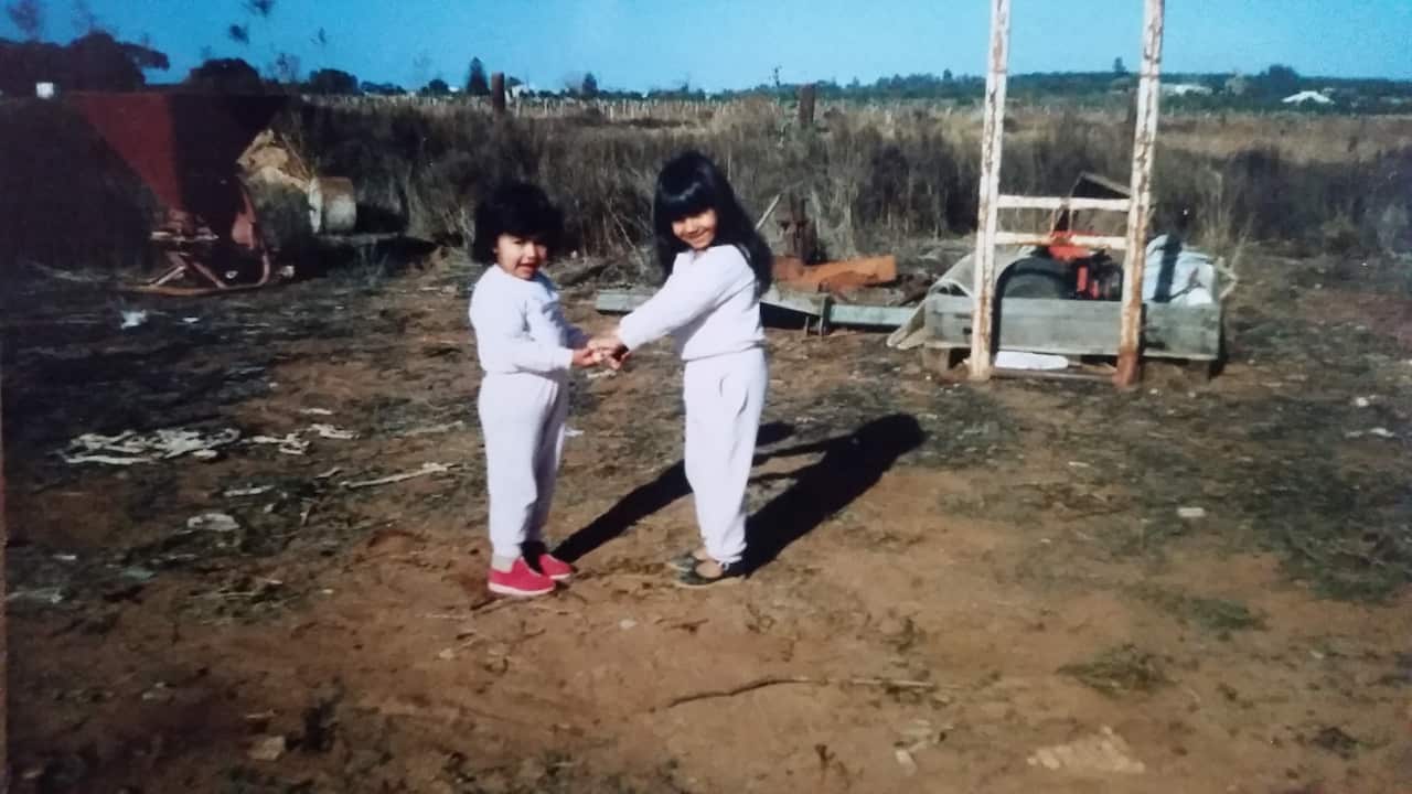 A young Johal with her sister. 