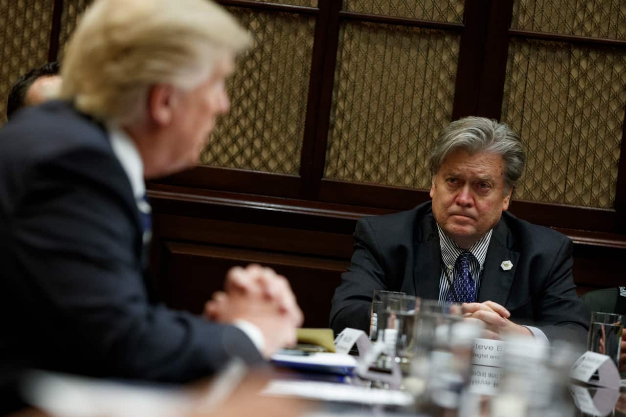 Then-White House Chief Strategist Steve Bannon listens as President Donald Trump speaks in 2017. 