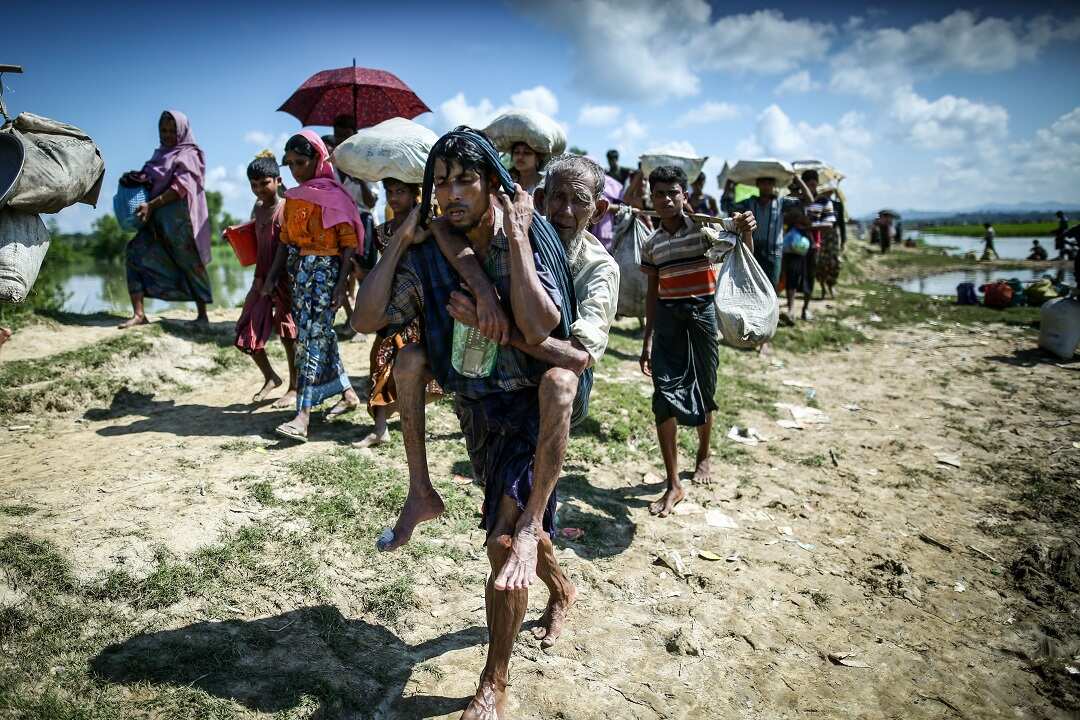 Rohingya refugees walk from Myanmar to Bangladesh in 2017.