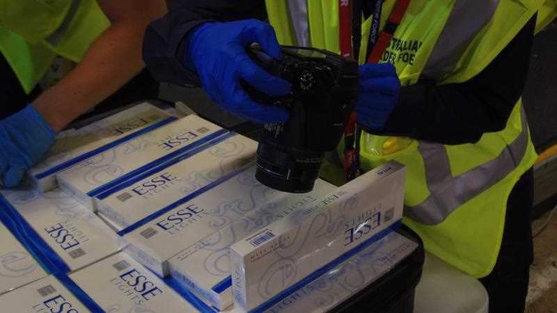 Australian Border Force officials inspecting illegal cigarettes in relation to an international organised tobacco smuggling syndicate.