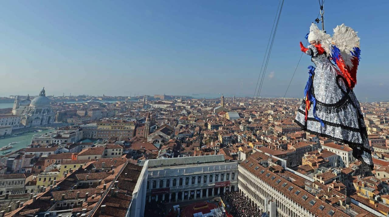 Elisa Costantini, the winner of the 'Festa delle Marie' (Marie contest), descending on a zip line from the Campanile (Bell Tower) into the Piazza San Marco.