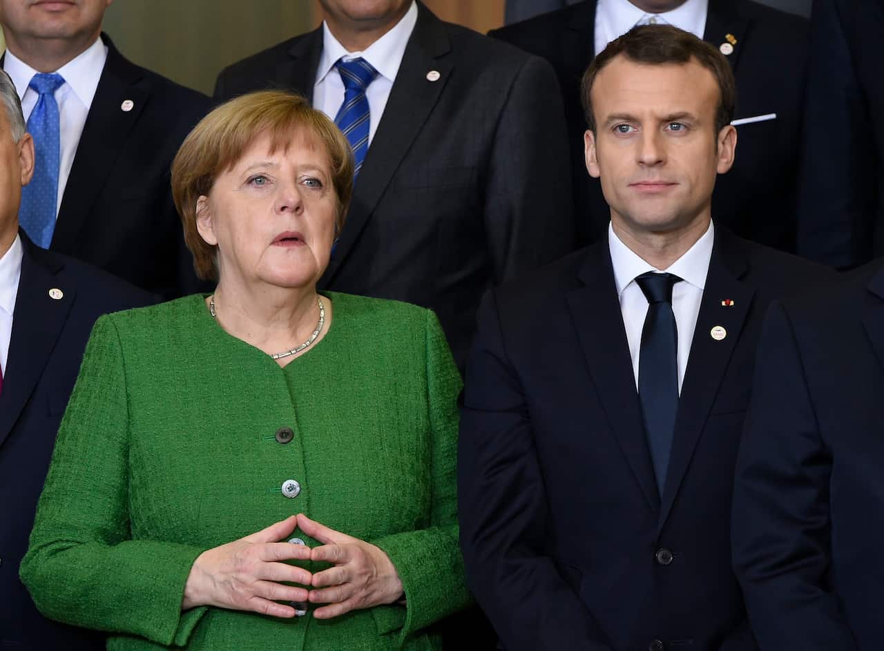 Emmanuel Macron and Angela Merkel.