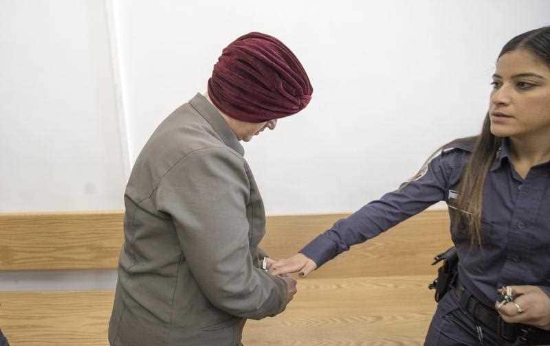 Malka Leifer (L), seen as she is brought to Jerusalem District court for a hearing by the Israeli prison service guards on 27 February 2018.