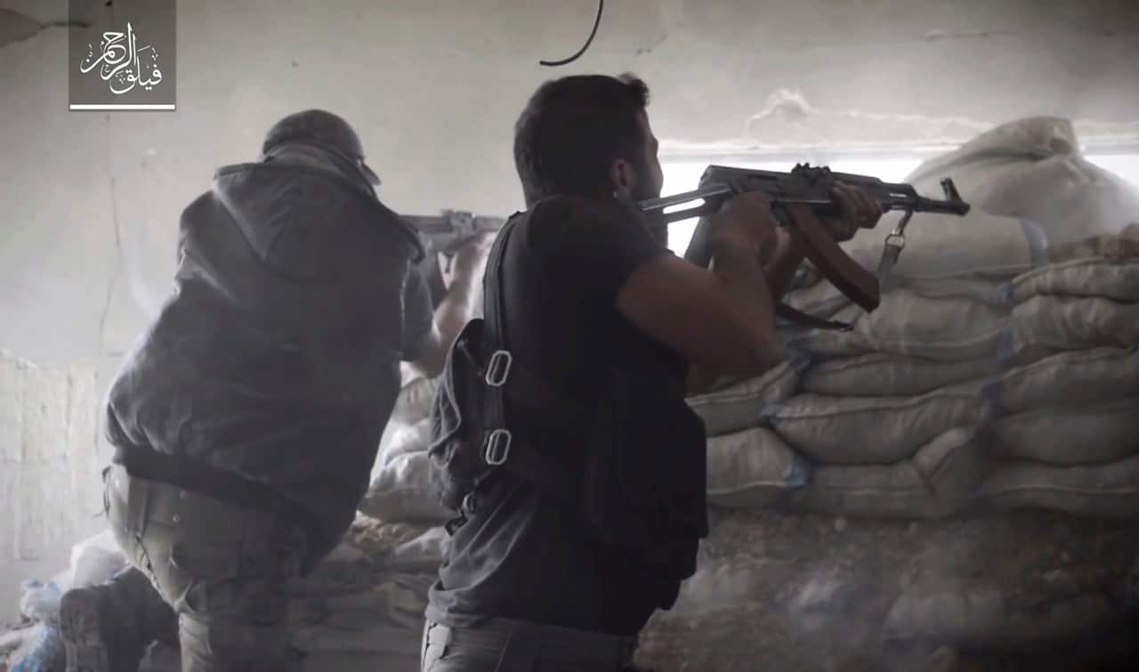 Rebel fighters with Failaq al-Rahman during clashes with government forces in the suburbs of the Syrian capital Damascus.