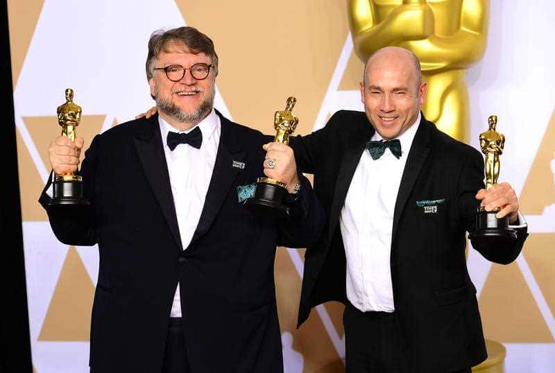 Guillermo Del Toro and J. Miles Dale with their Best Picture Oscar for The Shape of Water.
