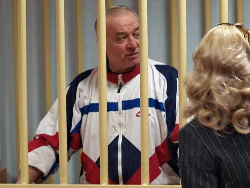 A photo dated 09 August 2006 shows Sergei Skripal talking from a defendants cage to his lawyer during a hearing at the Moscow District Military Court in Moscow, Russia.