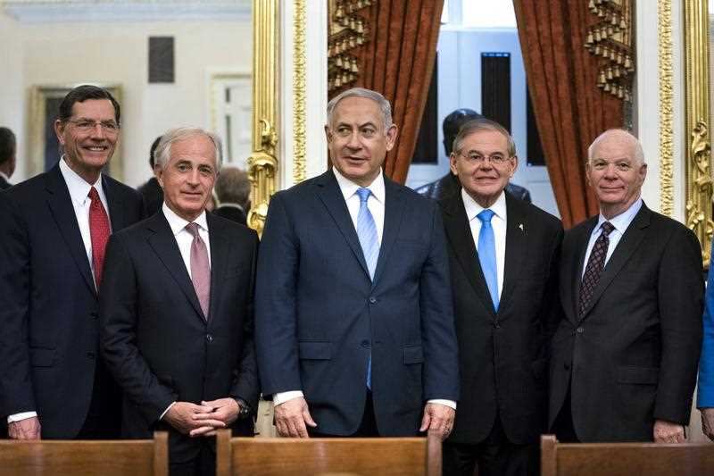 Israeli Prime Minister Benjamin Netanyahu (centre) poses for a picture with members of the US Senate Foreign Relations Committee.