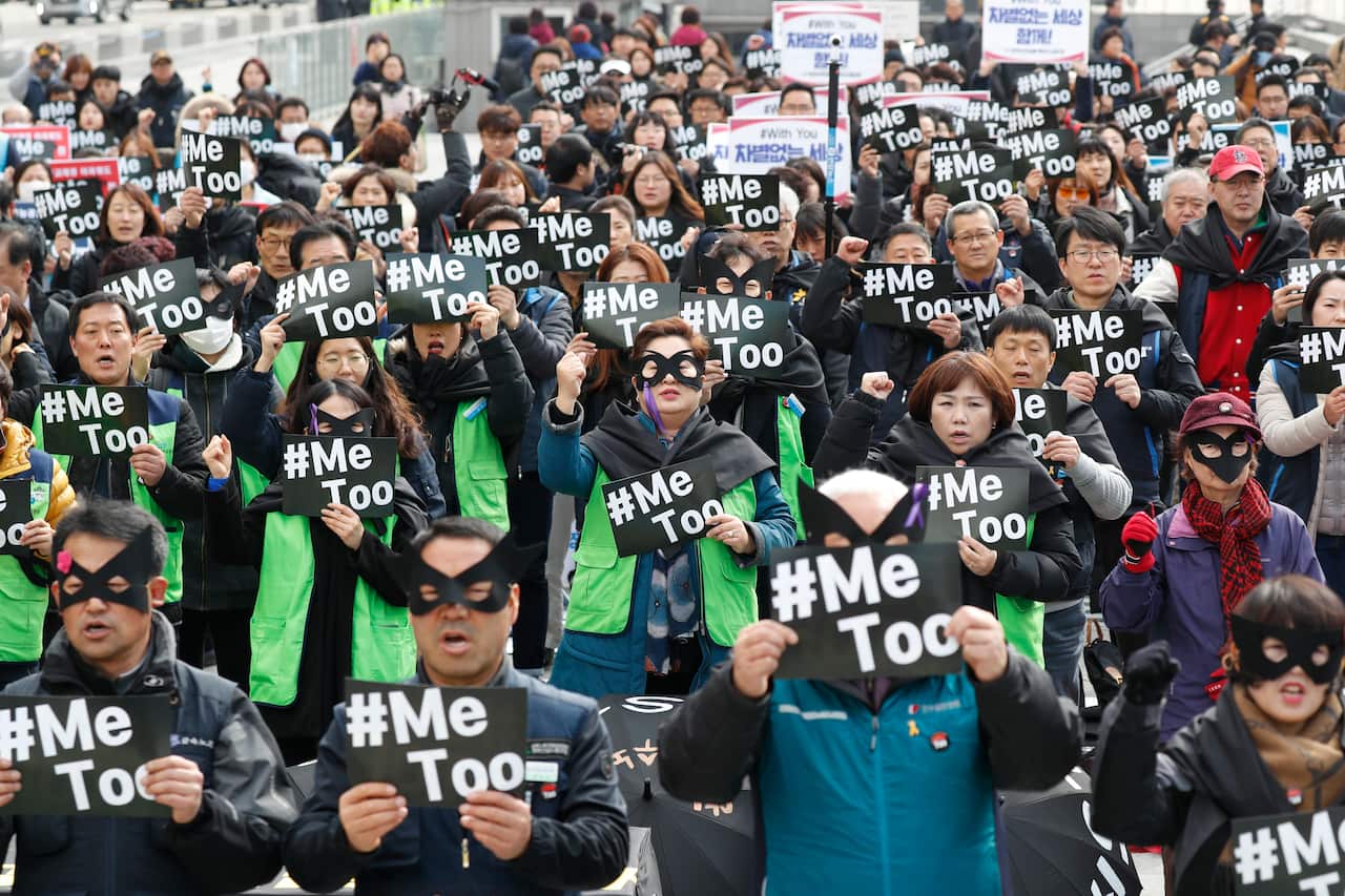 In this March 2018 file photo, people show their support for the #MeToo movement during a rally for women labourers in downtown Seoul.