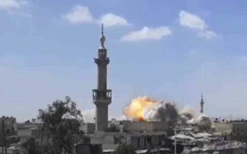  flames rising from a Syrian government forces airstrike attack, in eastern Ghouta, suburb of Damascus, Syria.