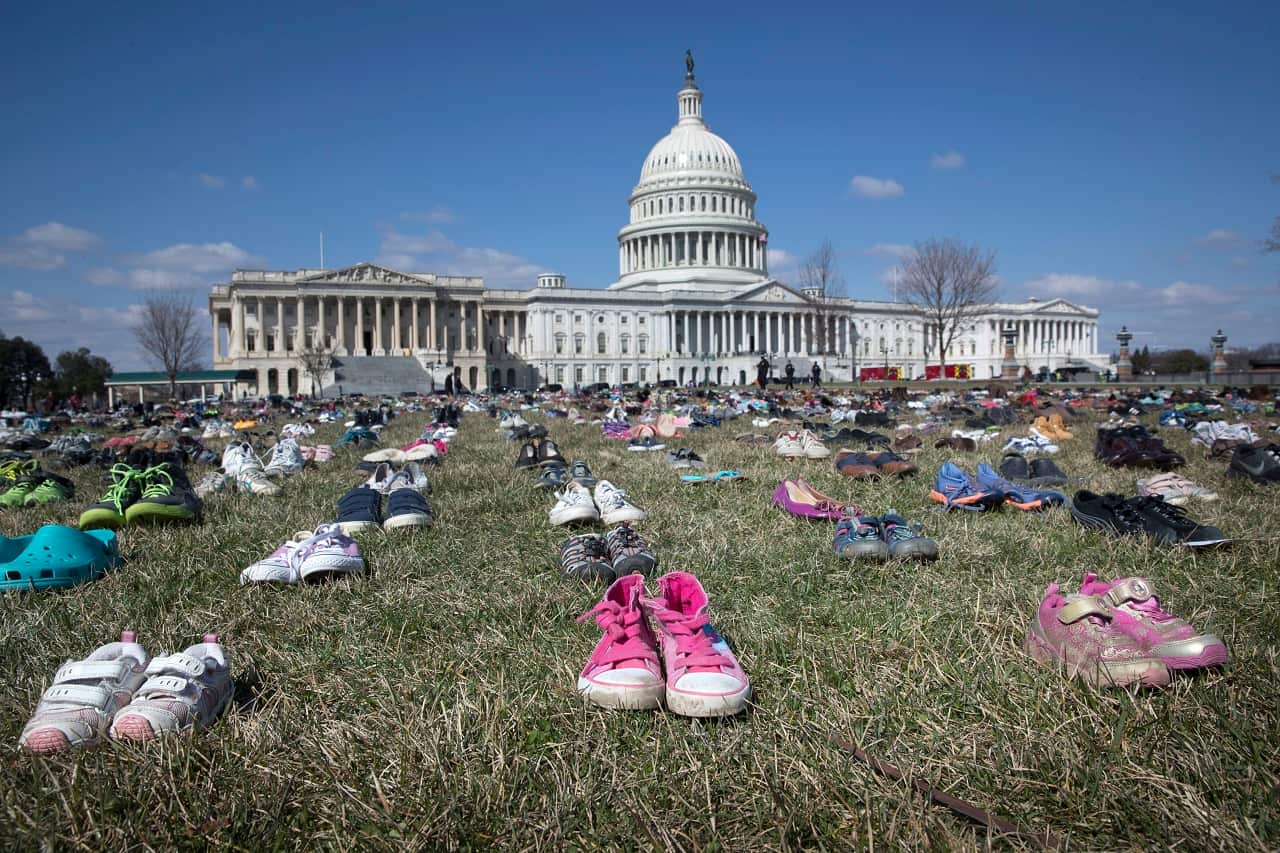 Thousand of shoes outside US Congress represent children lost to guns since Sandy Hook.