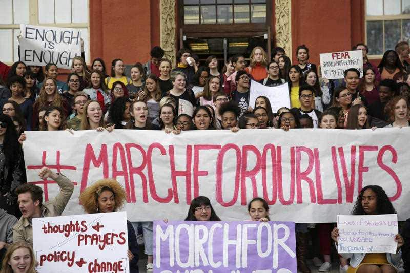 Students chant during a walk out at the Las Vegas Academy of the Arts, Wednesday, March 14, 2018, in Las Vegas.