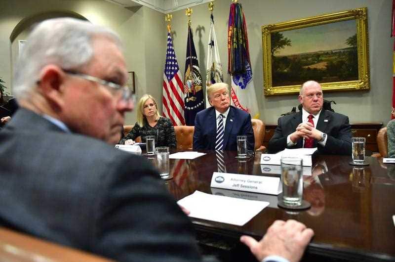 US President Donald J. Trump (C) holds a law enforcement roundtable on sanctuary cities, in the Roosevelt Room at the White House on in Washington.
