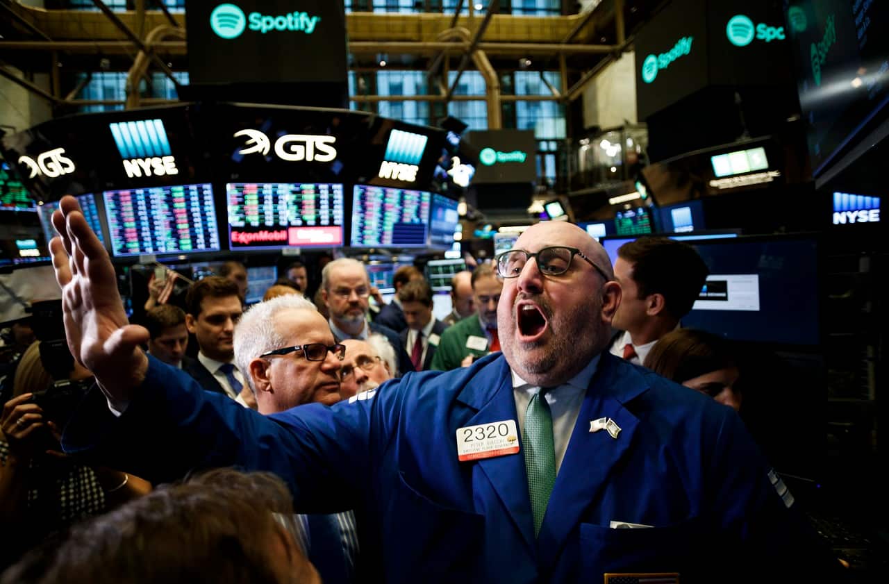 Specialist Peter Giacchi announces the start of trading of shares of Spotify at the New York Stock Exchange during the company's Initial Public Offering.